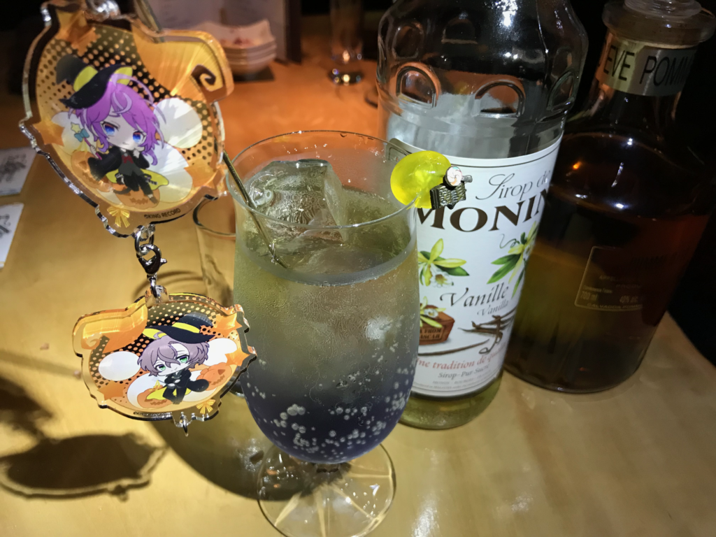 A photograph of a cocktail and its ingredients