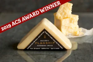 A wedge of Beecher's Flagship Cheddar Cheese