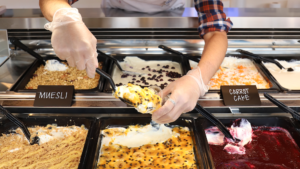 trays of Ellenos Yogurt in seattle, with various toppings 