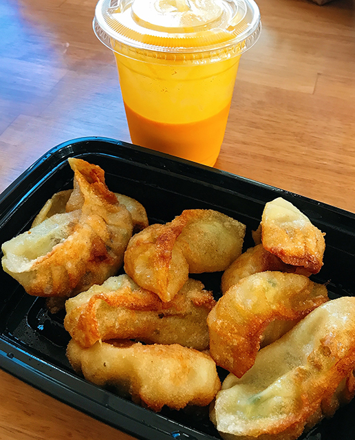 fried nepali dumplings with a cup of mango lassi